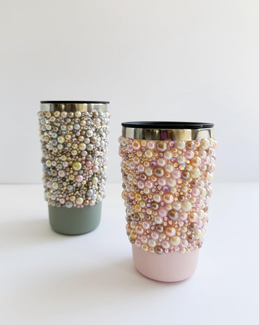 a couple of cups that are on a table