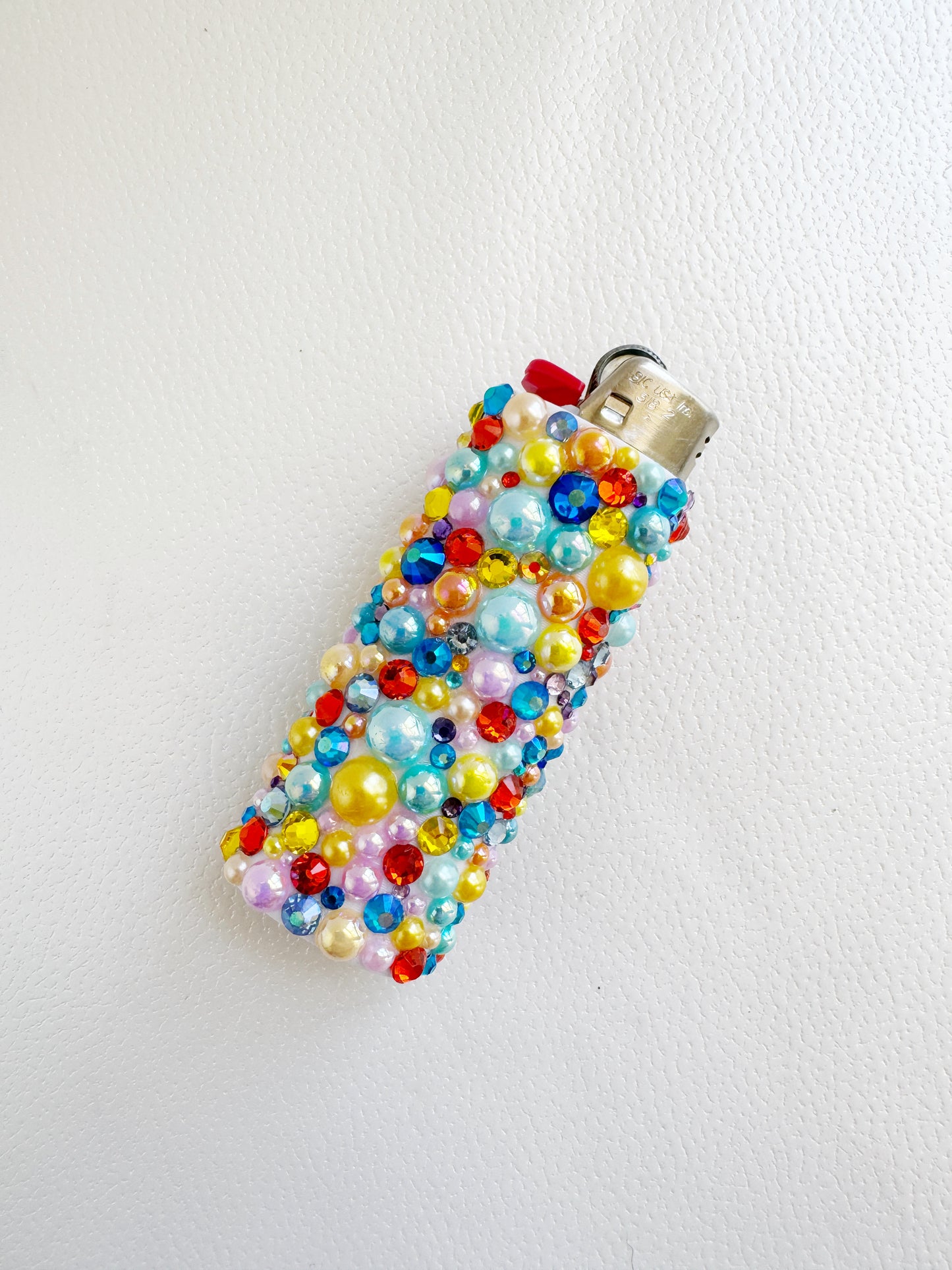 a cell phone covered in beads and beads