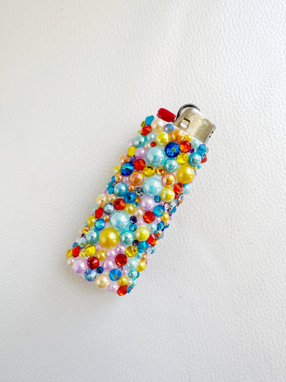 a cell phone covered in beads and beads