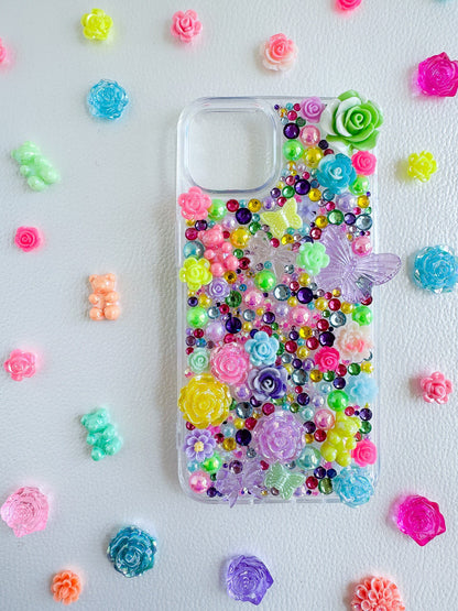 a phone case with flowers and beads on it