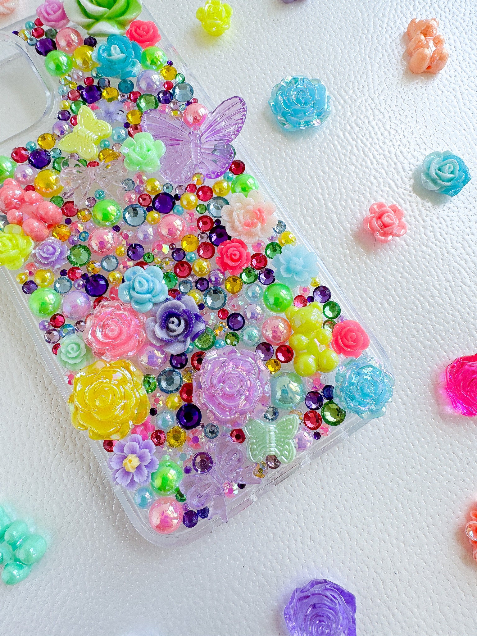 a phone case with lots of colorful flowers on it