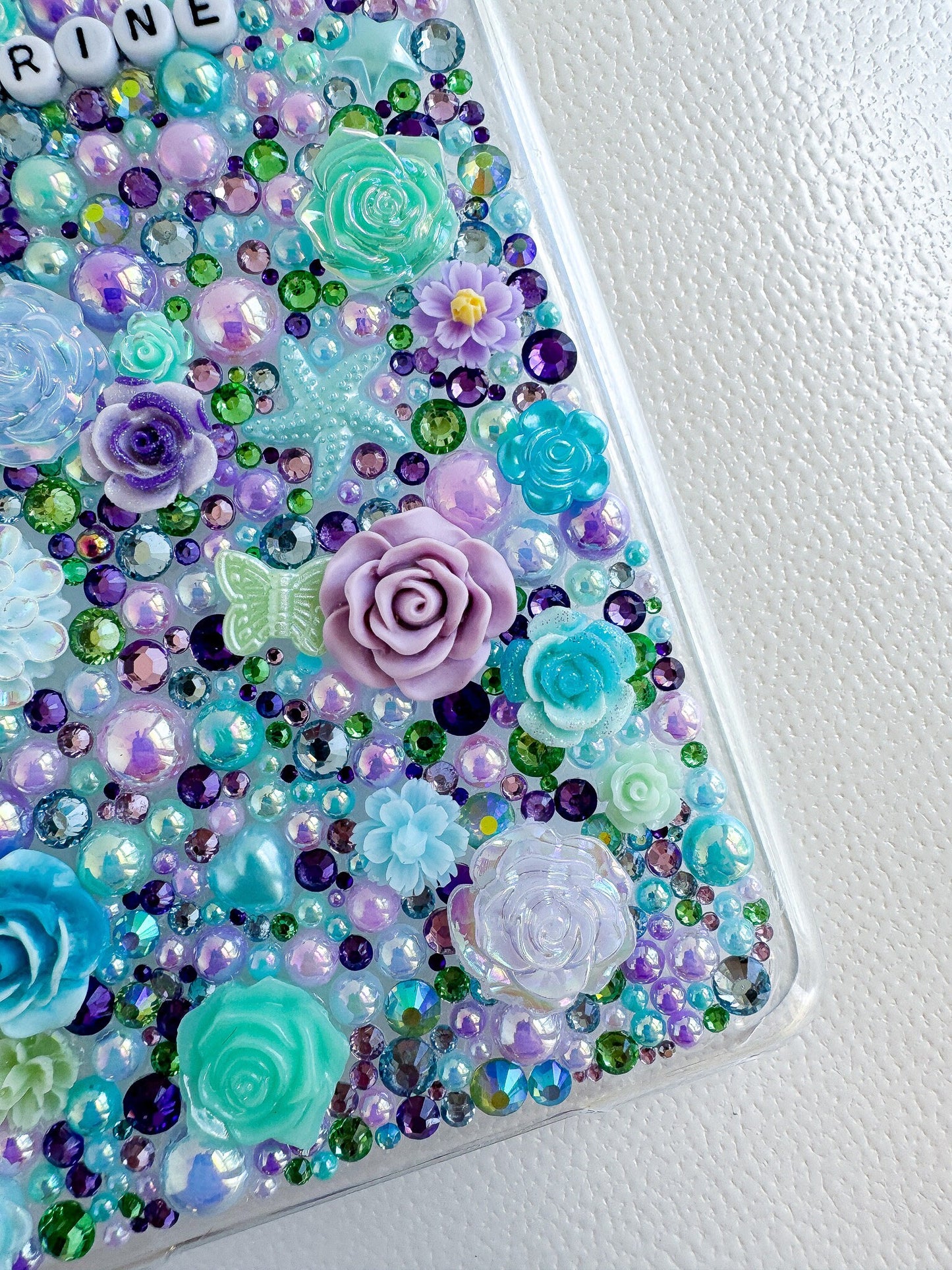 a phone case with a bunch of flowers on it