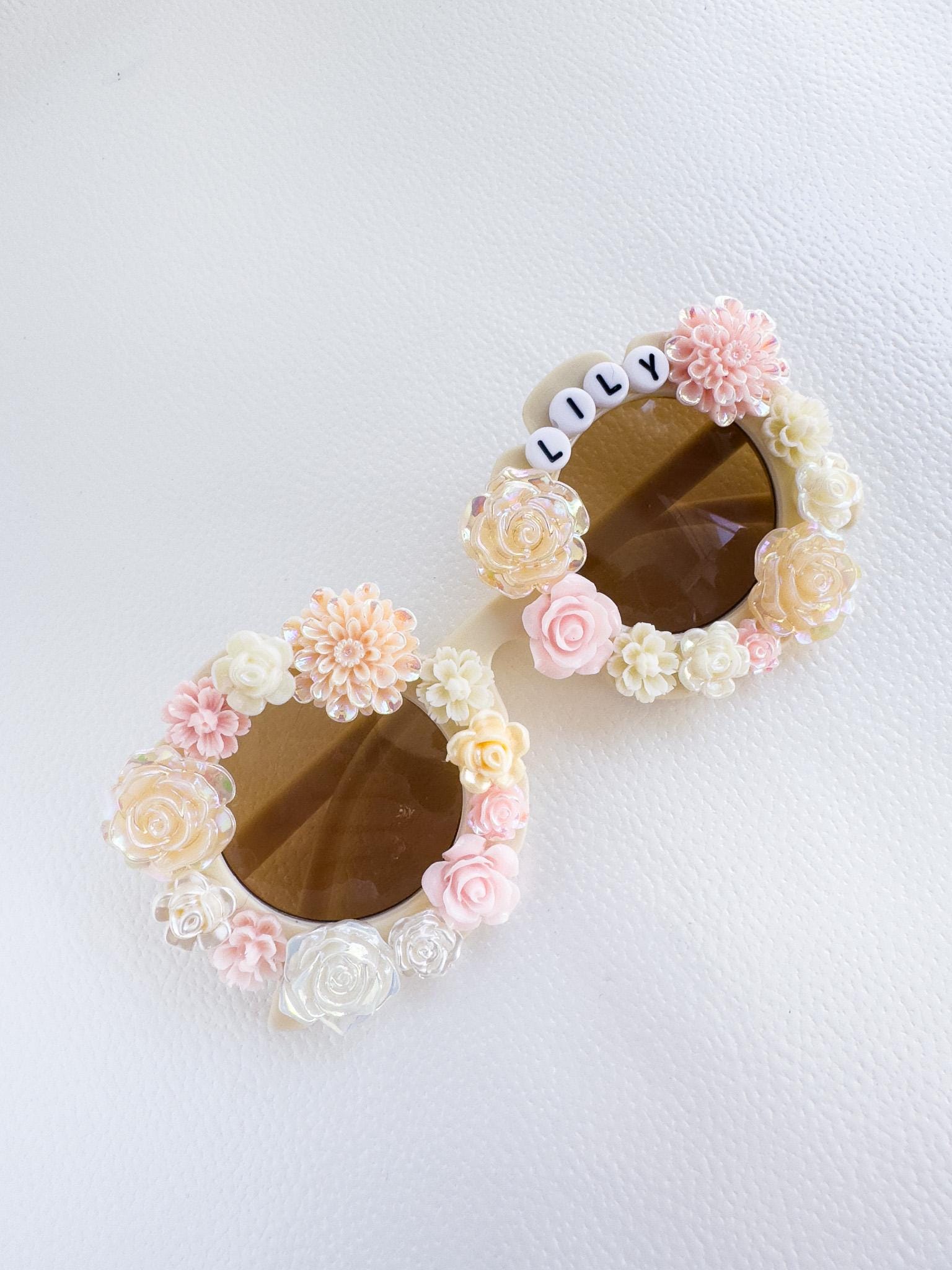 a pair of sunglasses with flowers on them